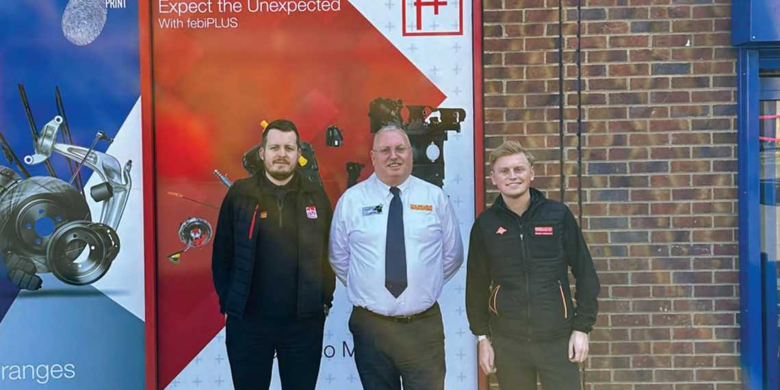 Photo of Tom, David and Ben outsite the front window of the building.